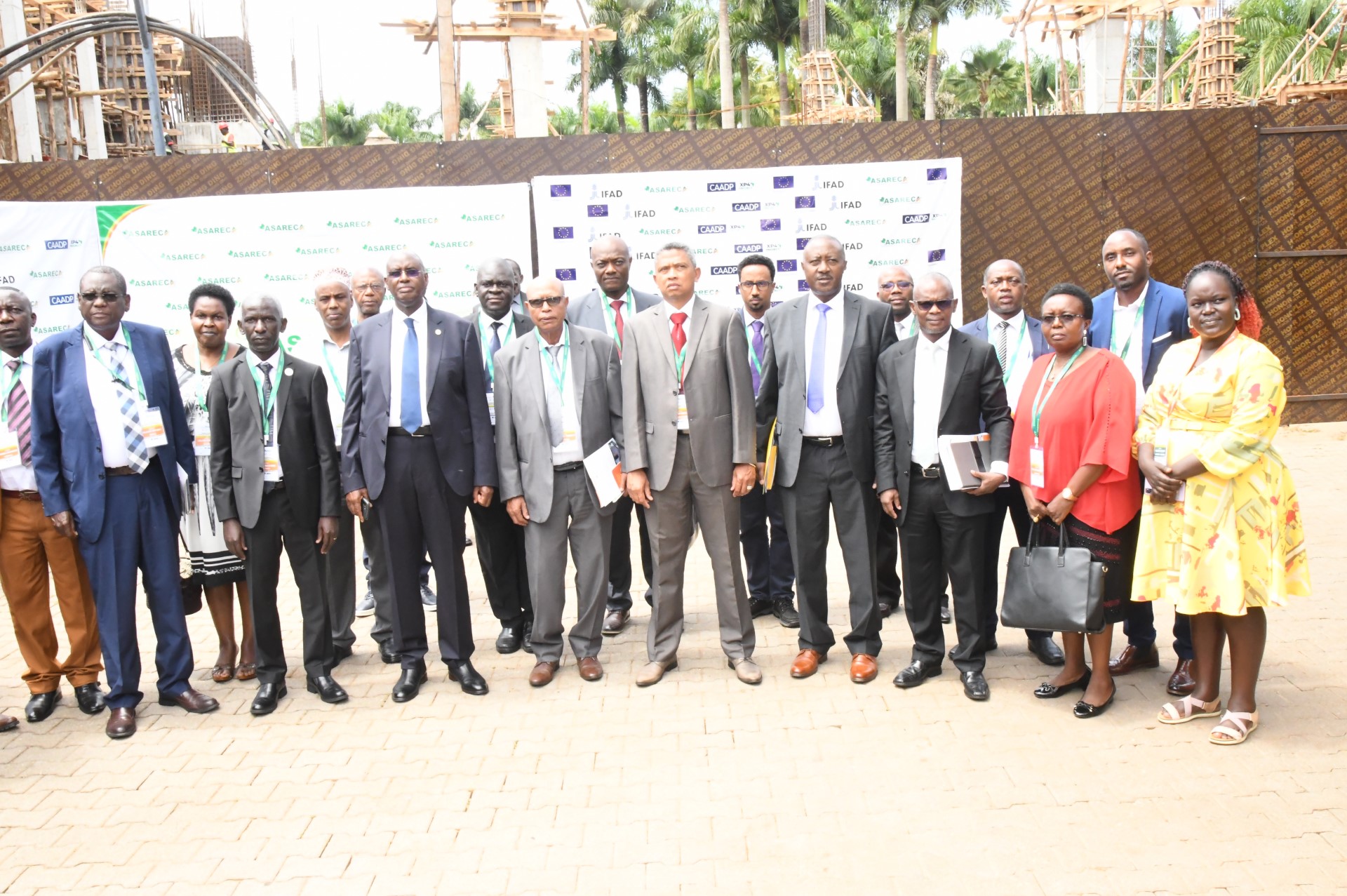 Hon. Rwamirama is joined by some of the delegates at the General Assembly for a group photo