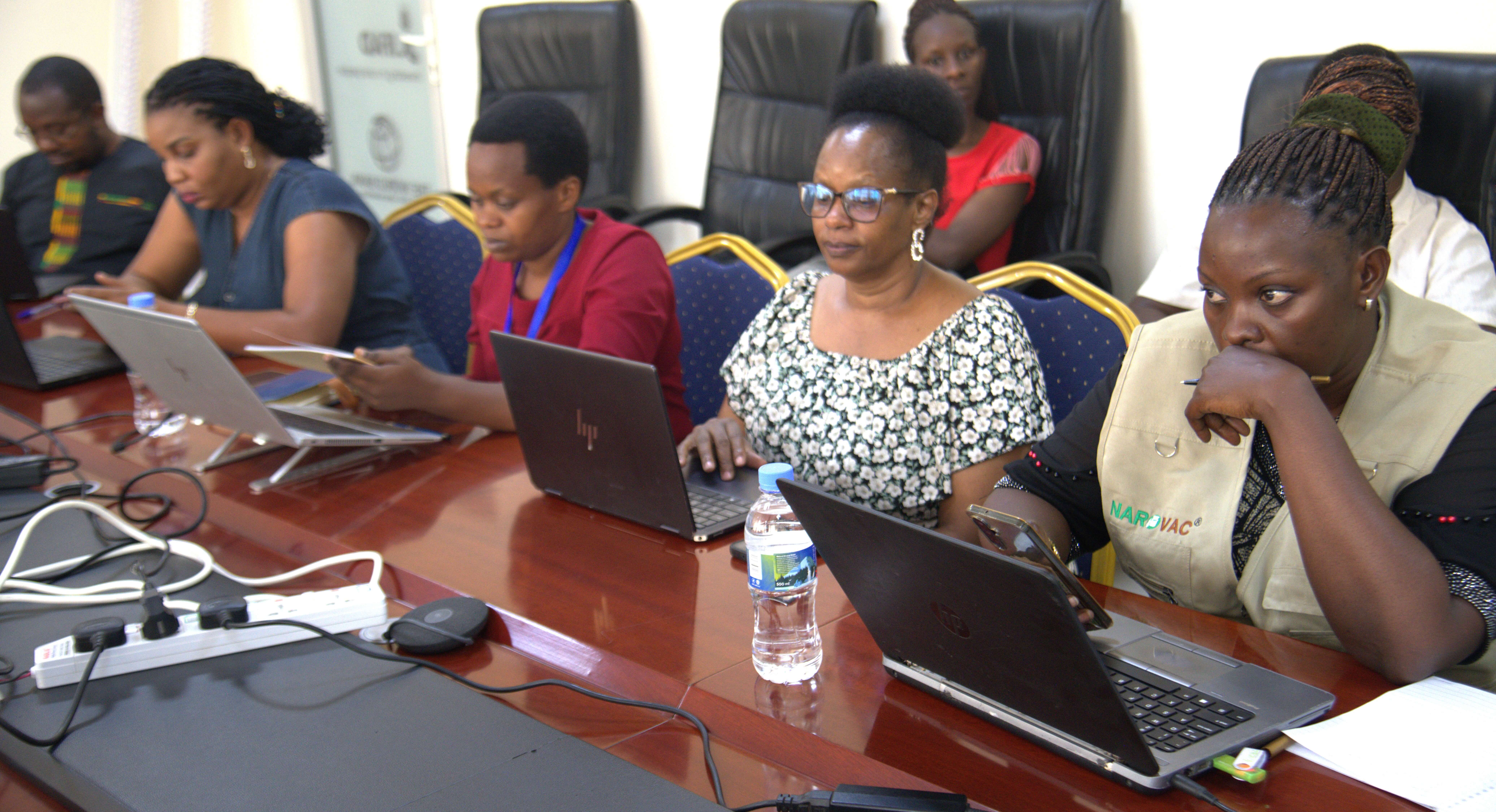 Participants take information on Azolla farming during the training workshop in Kigali